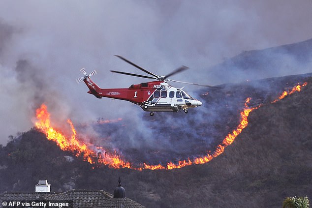 Maholias described seeing two helicopters flying overhead, trying to pour water on the inferno as it spread across 1,260 hectares of the city.