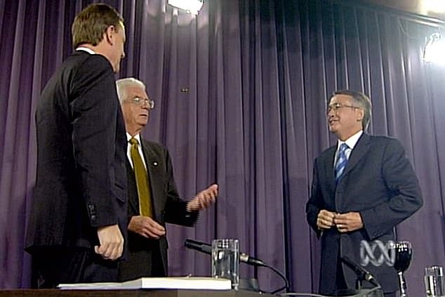 Mr Randall (pictured centre) moderated the first televised debate between former Prime Minister Bob Hawke and then Opposition Leader Andrew Peacock in 1984 (pictured left Peter Costello and pictured right Wayne Swan)