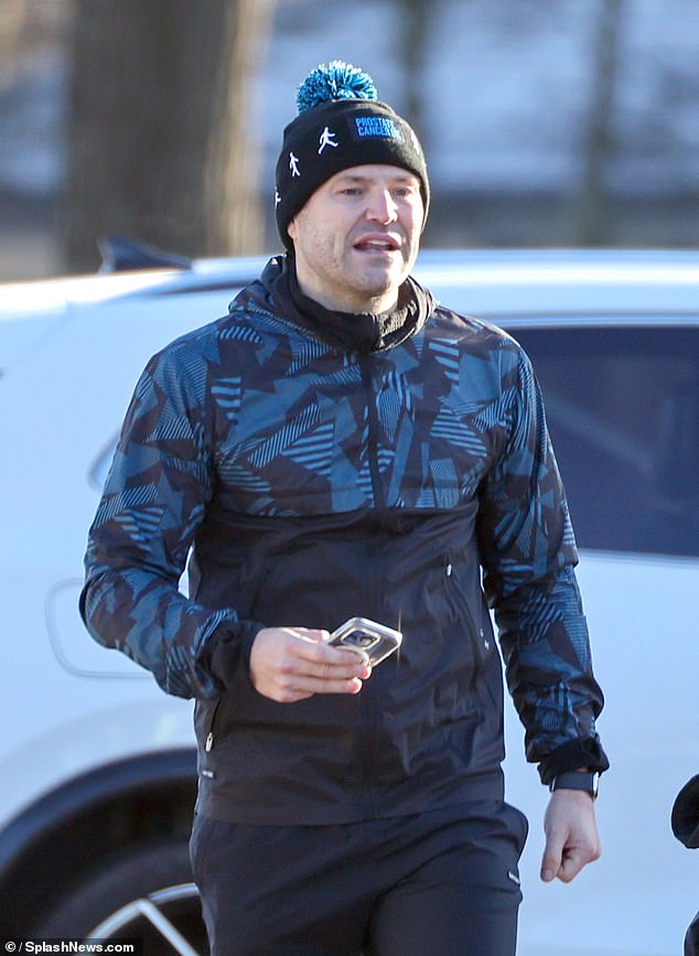 Mark, 37, who is expecting his first child with Michelle Keegan, 37, put on a brave face as he went for an early morning run with a group he coaches in Essex on Wednesday