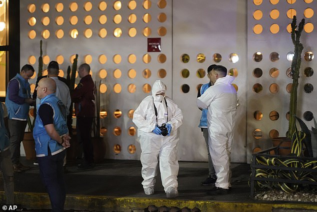 Forensic investigators leave the hotel where the former One Direction singer was found dead after falling from a balcony in Buenos Aires