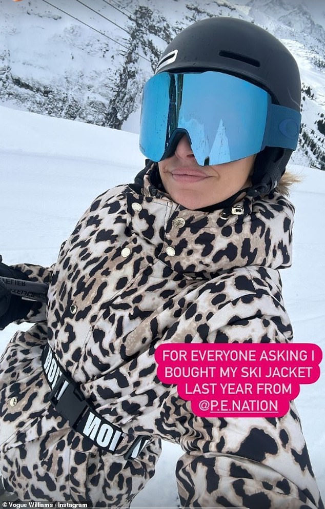 Vogue, 39, looked stylish as she rocked a leopard print coat and blue glasses