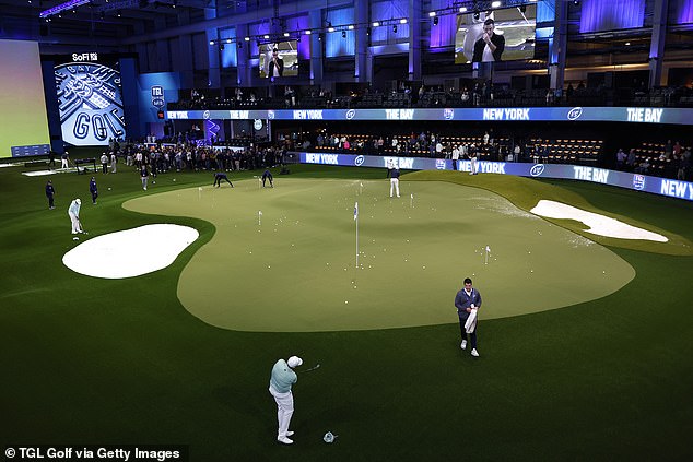 Players warm up on the putting green at the SoFi Center as fans make their way to the arena