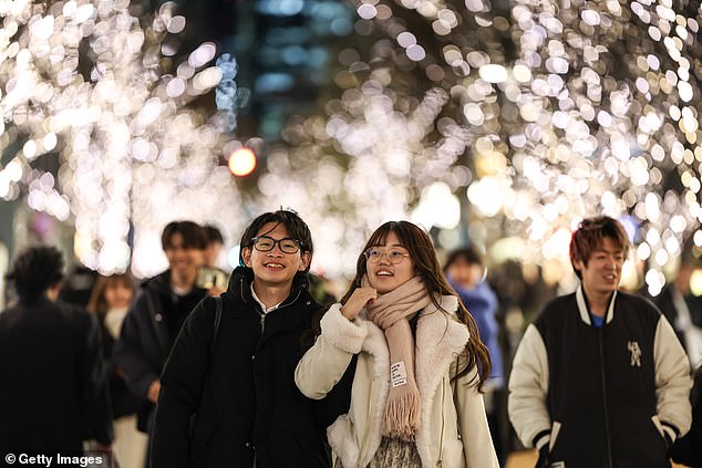 A young couple in Tokyo. Last year, the Tokyo subway government even launched its own dating app to boost the birth rate. The move was described by a Tokyo official as a 