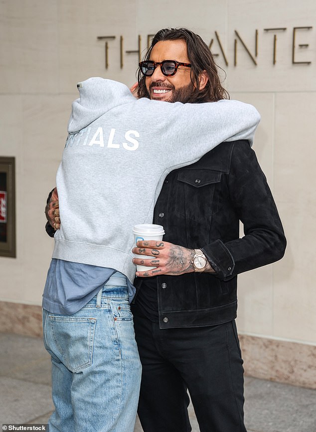 Newly single Sam, 32, who recently split from girlfriend of five years Zara McDermott, looked happy as he hugged his boyfriend Pete