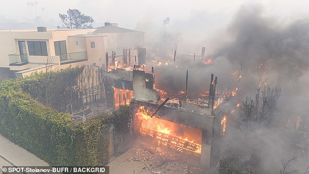 Shocking photos show the once-beautiful family home in the glitzy celebrity enclave reduced to a smoking wreck, with the roof burned away and flames tearing through the rooms