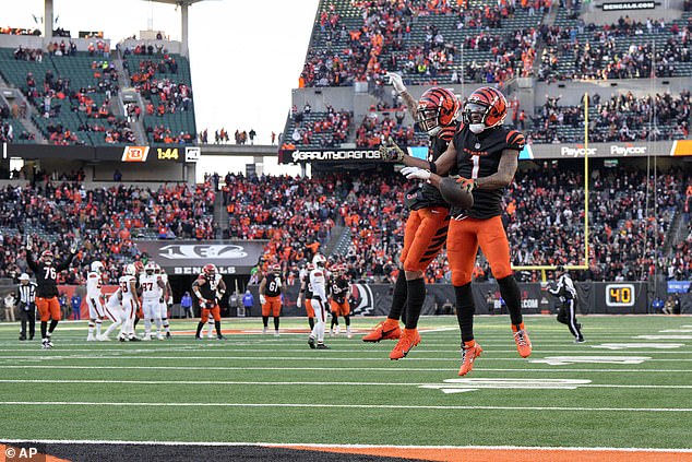 Burton celebrates with teammate Ja'Marr Chase against the Cleveland Browns last month