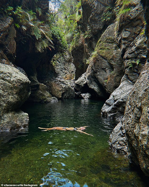 Australian adventurers flock to the beautiful Northbrook Gorge, hidden in the middle of the rainforest, with beautiful emerald green water, just outside Brisbane.