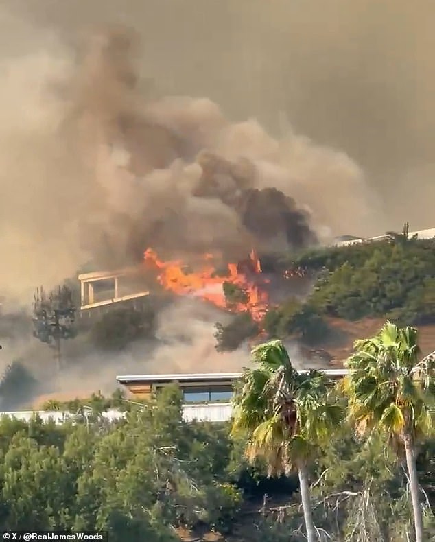 Actor James Woods shared footage of a house two blocks away from his property completely engulfed in flames