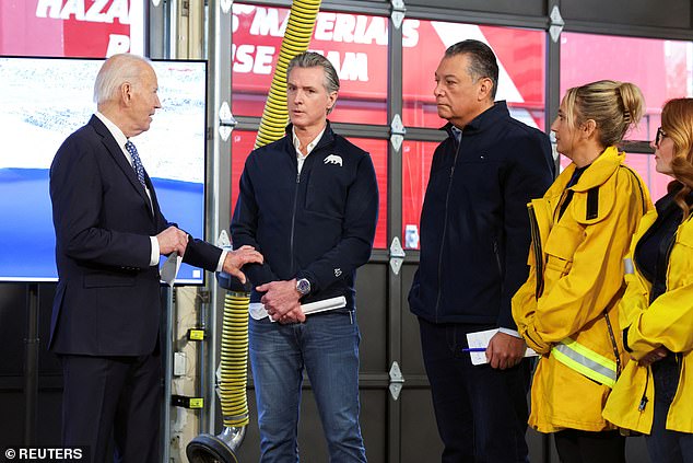 US President Joe Biden speaks with California Governor Gavin Newsom as he visits a Santa Monica fire station to receive a briefing from Cal Fire officials on the Palisades Wildfire in Santa Monica on Wednesday