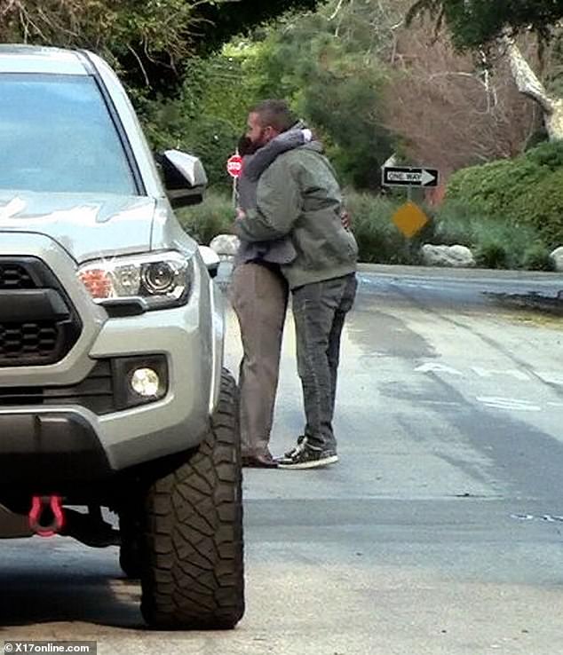 He wore a hooded sweatshirt and sported his signature beard as he hugged an acquaintance before getting back into his luxury SUV.