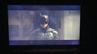 Samsung CU8000 with The Batman on the screen, with black non-uniformity