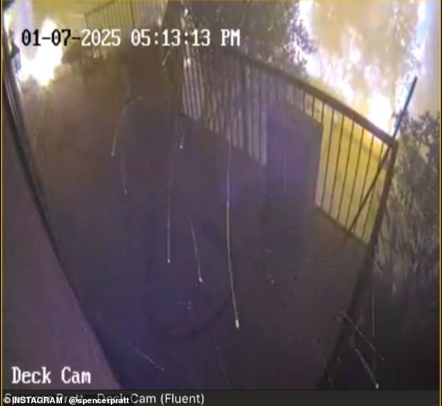 A security camera shows the fire raging outside the celebrity's home