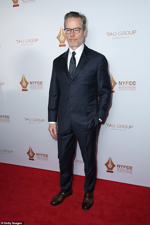 Guy Pearce, 57, was handsome as ever in a dark suit with a black tie