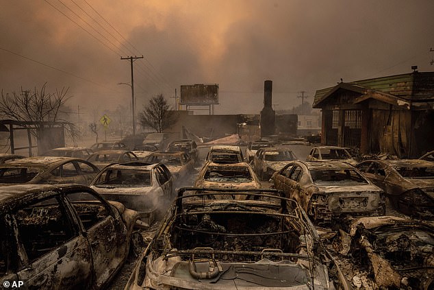 Vehicles left behind have been razed to the ground