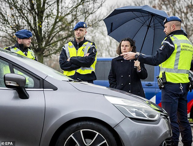 Minister of Asylum and Migration of the Netherlands, Marjolein Faber (C), at the start of border controls in Eijsden, Netherlands