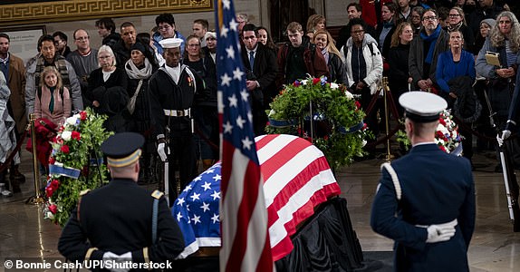 Mandatory Credit: Photo by Bonnie Cash/UPI/Shutterstock (15083562bl) Members of the public view President Jimmy Carter's casket as his body lies in state in the US Capitol Rotunda in Washington, DC on Tuesday, January 7, 2025. Carter's body will remain in state until a funeral service at the National Cathedral on January 9. Carter, the 39th president of the United States, died in December at the age of 100 on August 29, 2024 at his home in Plains, Georgia. Funeral for President Jimmy Carter in Washington, District of Columbia, United States - January 7, 2025