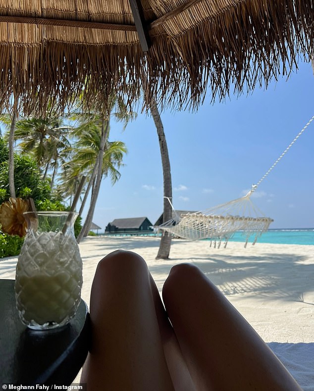 She sipped a cocktail as she looked out over the ocean