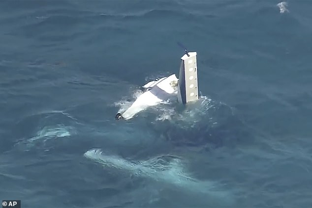 The ATSB has begun recovering and examining the wreckage from the crash site and it will take the agency time to determine what may have caused the crash (pictured seaplane submerged in water at Thompson Bay)