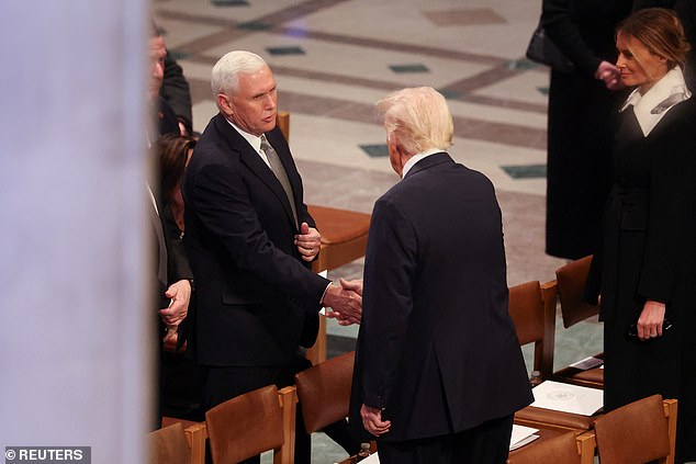 Donald Trump shakes hands with Mike Pence