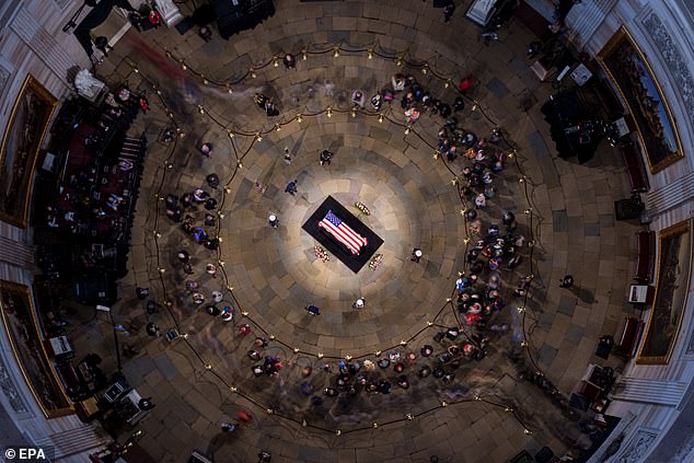 Jimmy Carter's flag-draped casket lay in state in the U.S. Capitol Rotunda