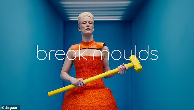 The ad shows boldly dressed fashion models in bright primary colors next to slogans such as 'break molds' and 'create exuberantly'