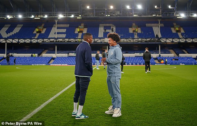 Ahead of kick-off, they shared a pre-match chat after being named on the substitutes bench