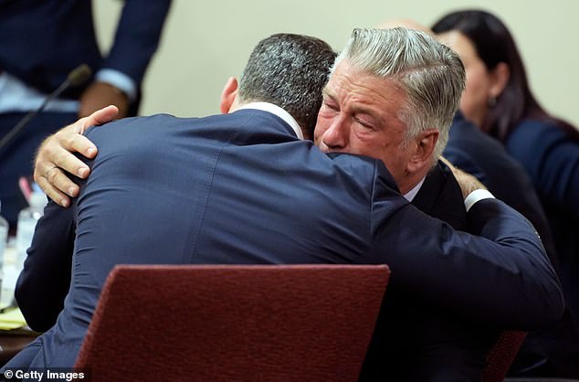 Alec Baldwin is pictured hugging his lawyer Alex Spiro at the end of his involuntary manslaughter trial