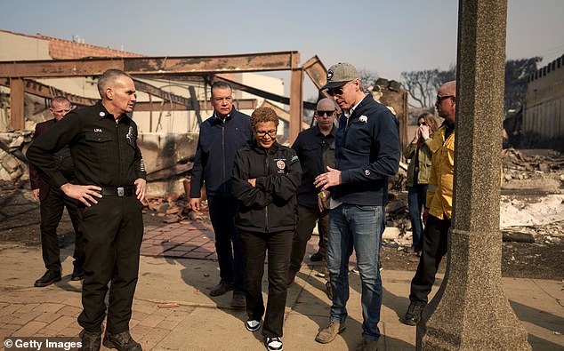 Many have complained about LA Mayor Karen Bass' absence in Africa as she fires fire hydrants without water and electricity to leave power lines on to fan the flames. (Image: Bass and Gavin Newsom touring the Palisades Wednesday)