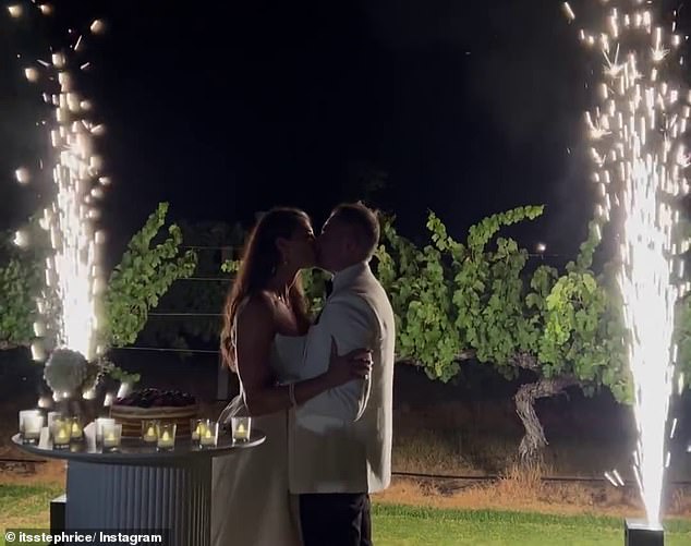 Later that evening, the couple kissed as sparklers lit up the sky behind them