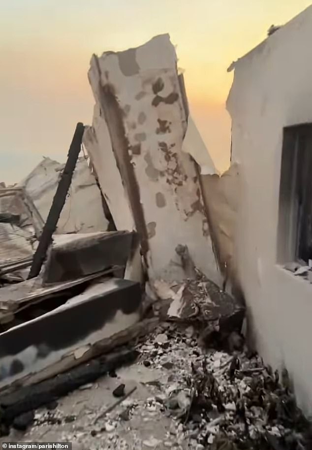 She filmed the clip as she walked through the remains of the entrance that was still standing, but then revealed that the rest of the house had been reduced to a pile of rubble.