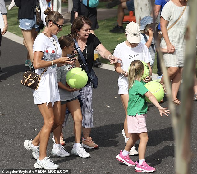 Candice was every bit the doting mother she was as she took her three tennis-obsessed daughters to meet their hero Aryna