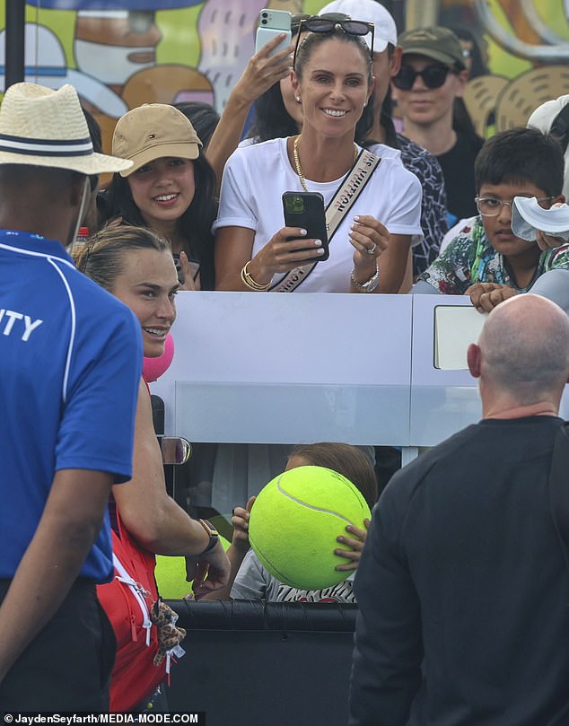 Candice couldn't wipe the smile off her face as she gathered among the large crowds to meet Aryna before taking the court for her Australian Open training.