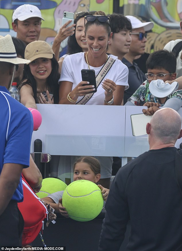 She managed to get Aryna to sign some giant tennis balls for her delighted daughters during the short meet-and-greet session on the court.