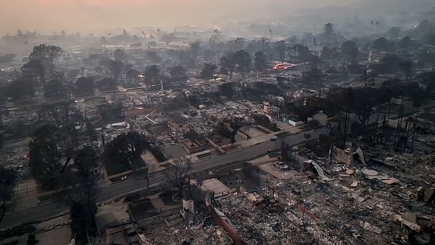 The epic damage and economic loss is estimated at between $135 billion and $150 billion (Pacific Palisades pictured Thursday)