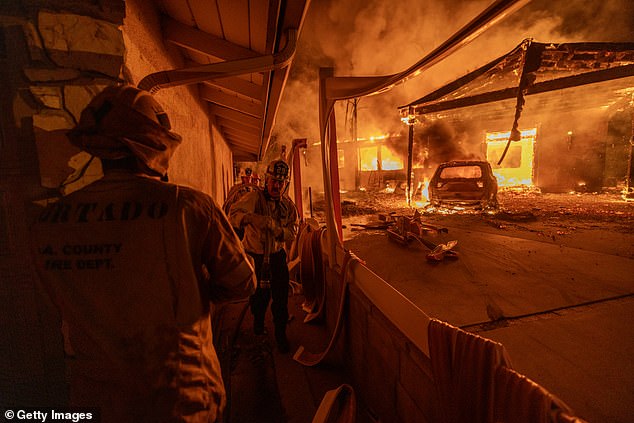 Firefighters battle the Eaton fire as it spreads across more than 10,000 acres in north Los Angeles