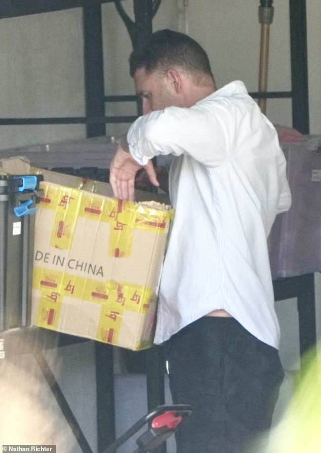 He was seen pulling out packages of clothes and possibly completing final orders for his men's athleisure business, which he closed late last year.