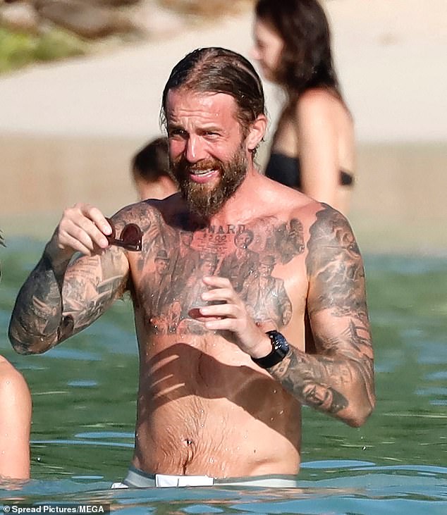 Adam Sumner, the partner of Rod's daughter Renee, 32, showed off his tattooed physique as he went shirtless