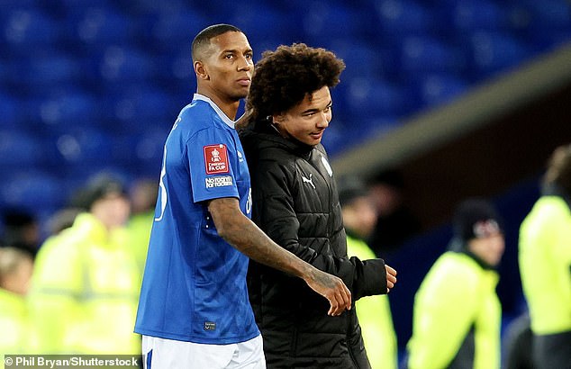 Ashley Young (left) admitted he was 'gutted' at being denied the chance to share the pitch with his son (right) and make FA Cup history