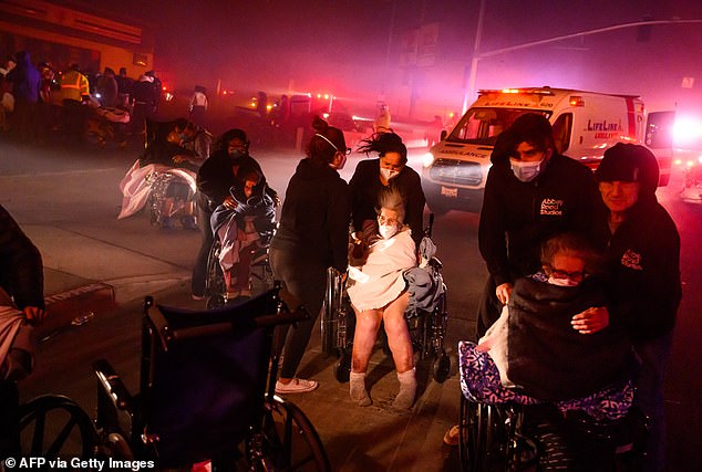 Elderly patients were evacuated in emergency vehicles as embers and flames approached during the Eaton fire in Pasadena, California