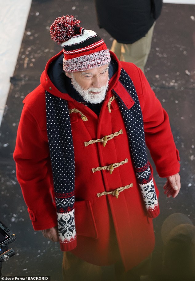 Arnold, 77, sported a white beard for his role as Jolly Old St. Nick and wore a red coat with toggle closures