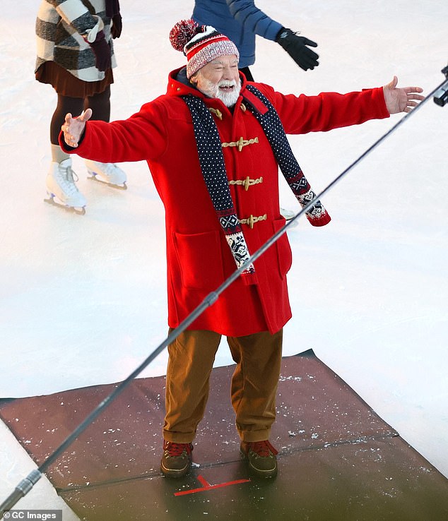 The jacket had a hood and the Jingle All the Way actor also wore a red, white and black scarf and a hat with a pom-pom on it