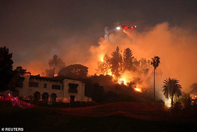 Flames rise from the Sunset Fire in the hills overlooking the Hollywood district of Los Angeles