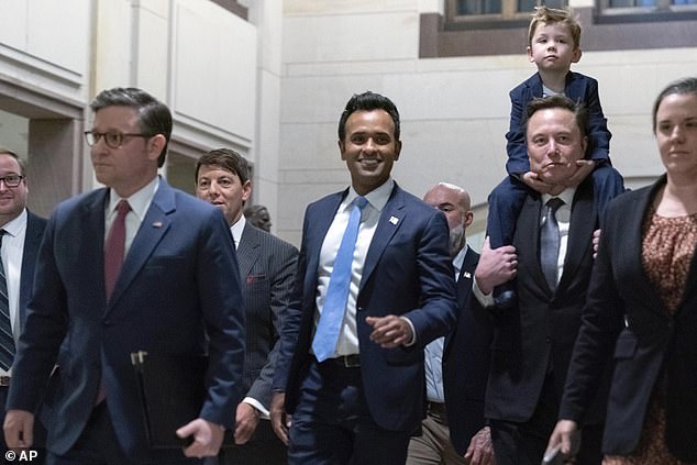 House Speaker Mike Johnson, R-La., from left, walks with DOGE co-leaders Vivek Ramaswamy and Elon Musk as they arrive for a roundtable discussion to discuss President-elect Donald's planned Department of Government Efficiency Trump to discuss in December