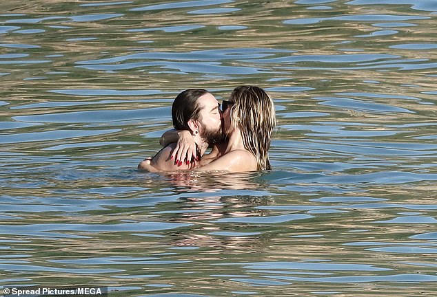 The couple enjoyed a steamy PDA session in the ocean, as well as sharing cuddles and staying close