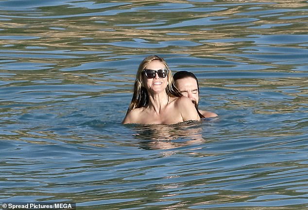 Heidi couldn't stop smiling as they stayed close in the water