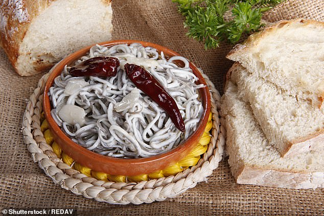 Baby conger eel oven baked in olive oil, served in terracotta dish