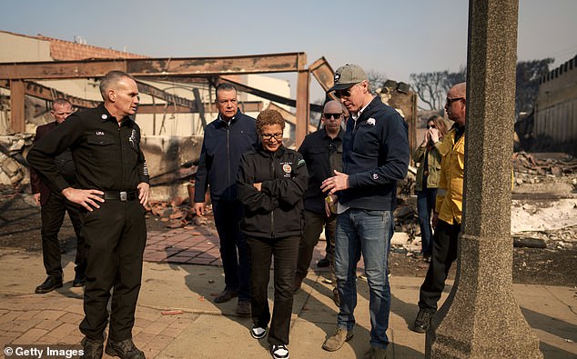 Many have complained about LA Mayor Karen Bass's absence in Africa, firing fire hydrants without water and electricity to power lines left on to fan the flames. (Image: Bass and Gavin Newsom touring the Palisades Wednesday)