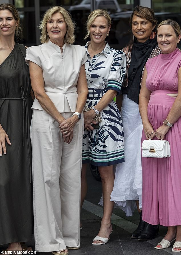 She packed her essentials into a woven handbag as she mingled with A-list guests while fulfilling her role as a Magic Millions ambassador