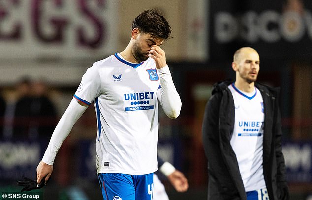 Rangers players Propper, left and Cerny look dejected after another failure away from home