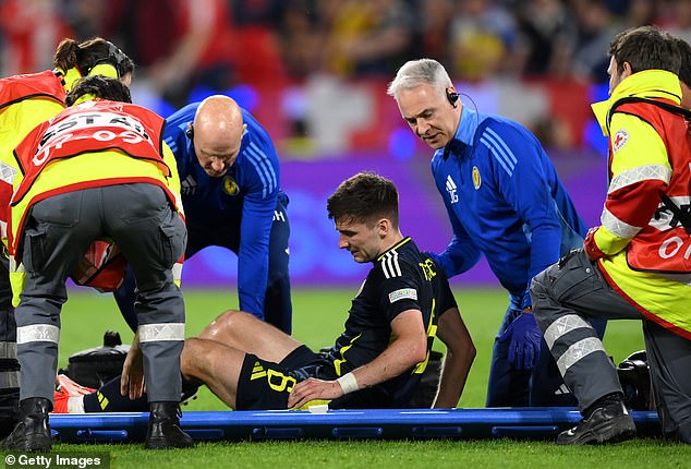 Injury-prone Tierney is stretchered off the field during Scotland's match against Switzerland